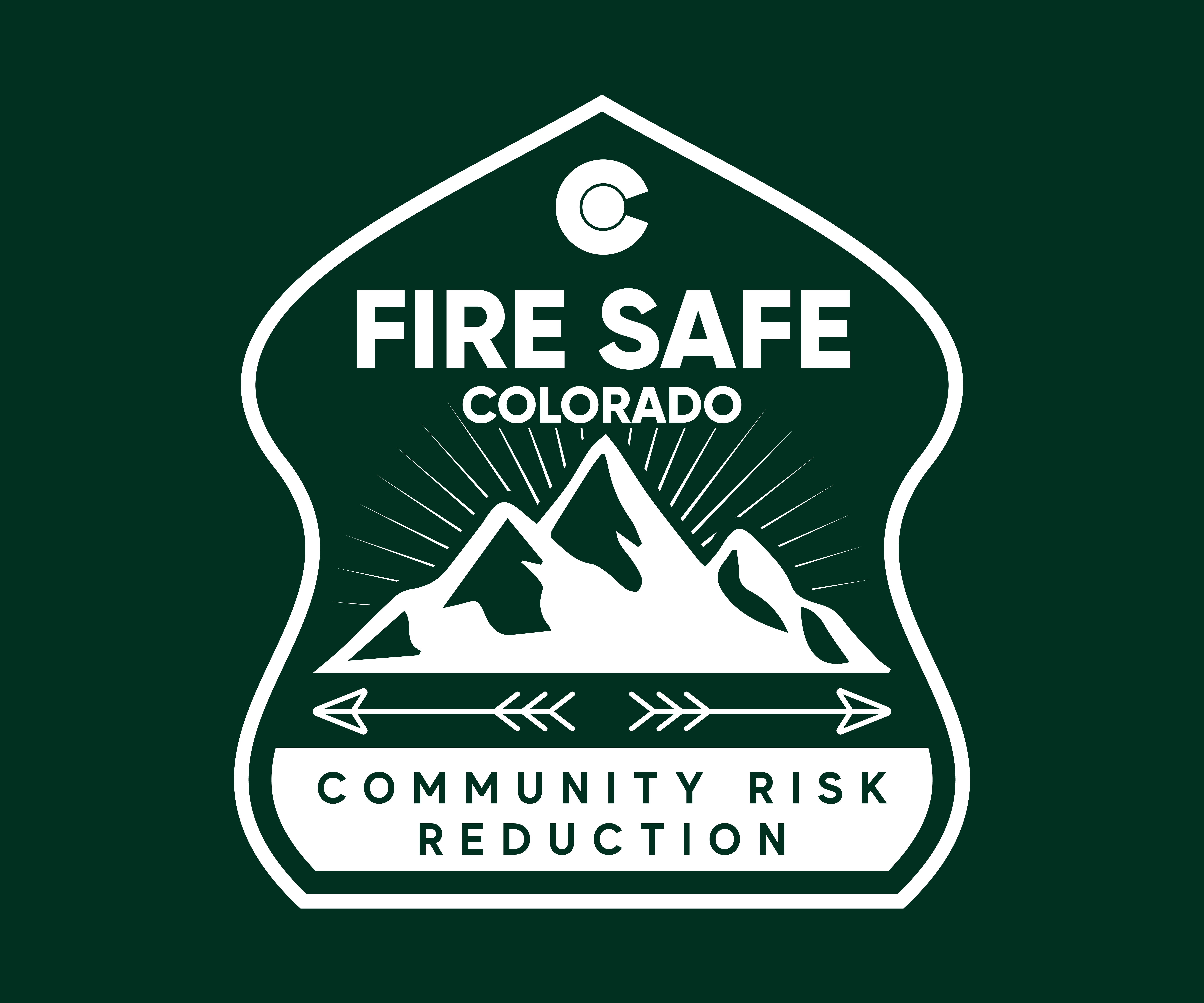 Fire Safe Colorado Logo - Dark Green Color, Mountains and arrows over the words "Community Risk Reduction" 